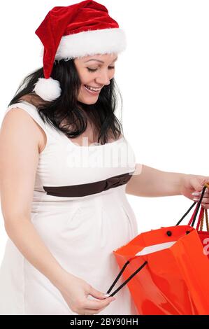 Pregnant woman with shopping bags Stock Photo