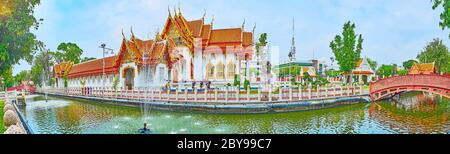 BANGKOK, THAILAND - MAY 13, 2019: Panorama with Ubosot (Ordination Hall) of Wat Benchamabophit Dusitvanaram Marble Temple behind the canal with founta Stock Photo