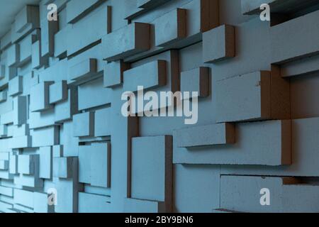 Geometric abstract background in shades of grey blue. Three-dimensional grunge backdrop with parallelogram and cube cement forms Stock Photo