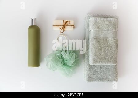 Bath towels with toiletries on white background. Flat lay, top view Stock Photo
