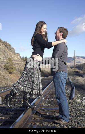 Couple on the train tracks Stock Photo