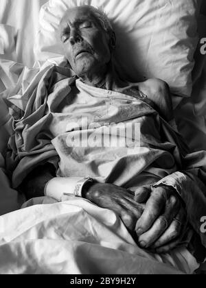 A 92 years old man lays in a geriatric hospital bed, Lyon, France Stock Photo