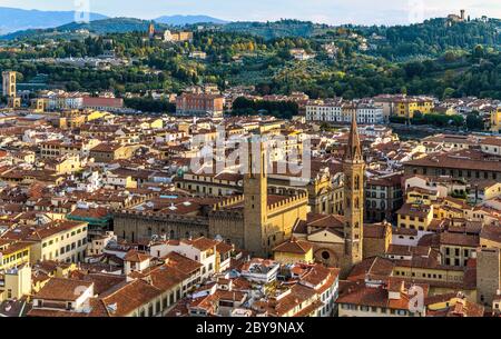 Sunset Florence - Panoramic sunset overview of Bell towers in south side of Old Town of Florence, as seen from Brunelleschi's Dome. Tuscany, Italy. Stock Photo