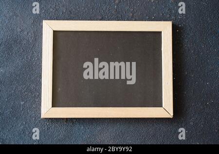 Empty blackboard background. Blank chalkboard in wooden frame. Stock Photo