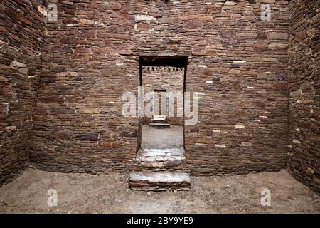 NM00602-00...NEW MEXICO - Masonry stone walls and doorways  at Pueblo Bonito built by the early Chaco People.  Chaco Culture National Historic Park. Stock Photo