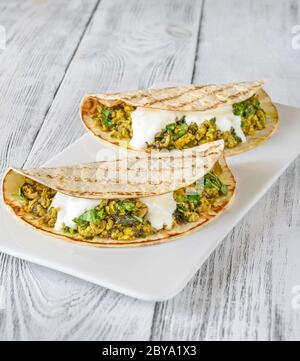 Indian spicy egg and spinach wraps Stock Photo