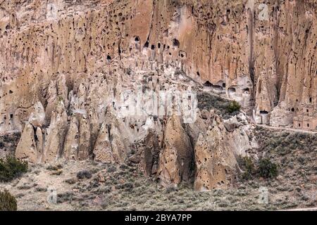 NM00639-00...NEW MEXICO - View of the talus houses cliff dwellings from the Frijoles Rim Trail in Bandelier National Monument. Stock Photo