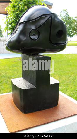 Black sculpture Tete (Head) by Joan Miro in front of the Botin Centre arts centre in Santander Cantabria Spain Stock Photo