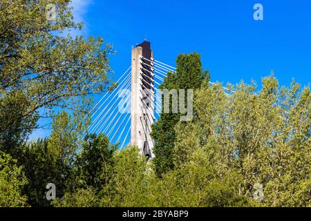 Warsaw, Mazovia / Poland - 2020/05/09: Panoramic view of Swietokrzyski Bridge - Most Swietokrzyski - with cable-stayed pylon over Vistula river Stock Photo