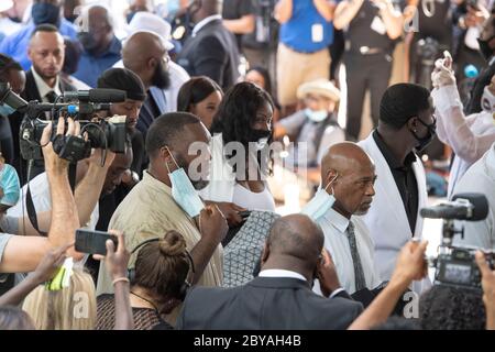 Family members and friends prepare to enter the sanctuary of Fountain of Praise Church in Houston on June 9, 2020 for the service honoring the life of GEORGE FLOYD. Floyd 's death in late May by a white policeman set off hundreds of protests worldwide against police brutality and racism. Stock Photo