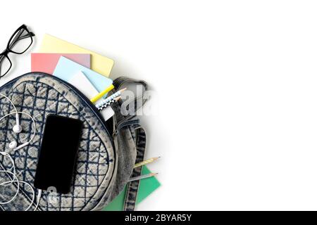 Flat lay top view backpack with different colorful stationery Stock Photo