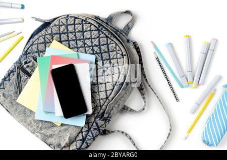 Flat lay top view backpack with different colorful stationery Stock Photo