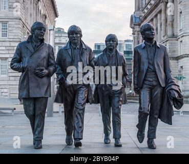 Beatles statue on the Liverpool waterfront seen just after sunrise in February 2016. Stock Photo