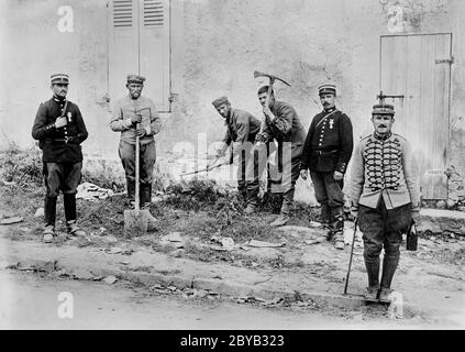 German Prisoners working on Road between Villeroy and Neufmontiers, France during World War I, Bain News Service, 1914 Stock Photo