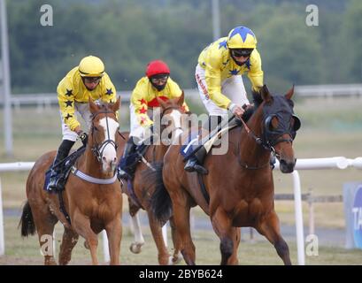 Cheng Gong and Dougie Costello win the Follow At The Races On Twitter Handicap at Wolverhampton Racecourse. Stock Photo