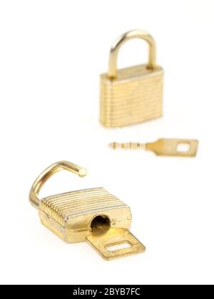 Opened en closed padlocks and keys isolated, focus in the front Stock Photo