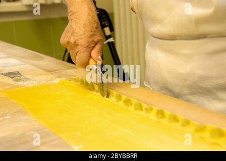 Preparation of agnolotti. Typical pasta of the Langhe, Piedmont - Italy Stock Photo
