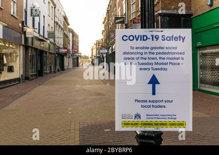 During the 2020 coronavirus pandemic King's Lynn Tuesday Market has returned to the Tuesday Market Place to aid social distancing in the High Street. Stock Photo