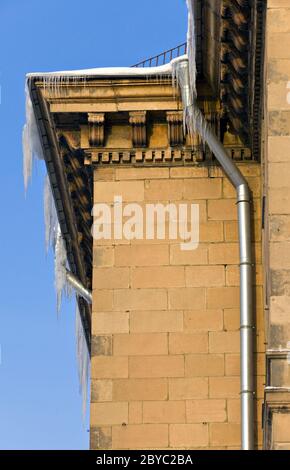 Huge icicles hang down from roof, Stock Photo