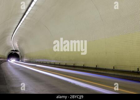 Car light trails inside Robert C Levy Tunnel (A.K.A. Broadway Tunnel) in San Francisco Stock Photo