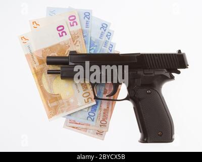 Semi-automatic gun and money isolated Stock Photo