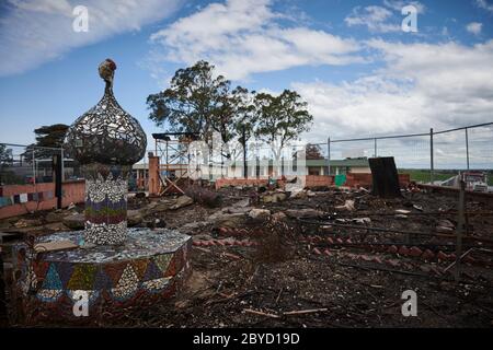 The burnt remains of a mosaic garden created by the students by the fires that hit Clifton Creek Primary School. Stock Photo