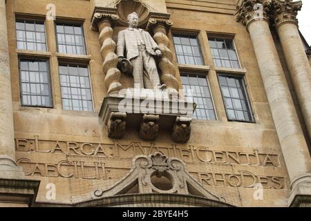 Cecil Rhodes statue stands at the front facade of the Oriel College in Oxford during the protest. Cecil was an English-born businessman, mining magnate, and politician in South Africa. The founder of the diamond company De Beers and the founder of the state of Rhodesia (now Zimbabwe) , which was named after him. The Rhodes Must Fall campaign was reignited from a 2016 campaign following recent Black Lives Matter demonstrations after the demise of George Floyd under police custody in Mineapolis. Despite the Covid19 lockdown, protesters globally have united to demand change. Stock Photo