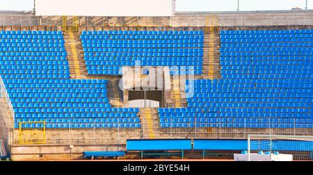 Empty rows of seats at football stadium Stock Photo