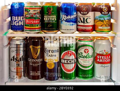 Calgary, Alberta, Canada. Jun 9 2020. Hotel fridge interior, mini bar with domestic and imported beers from around the world, in the hotel room. Stock Photo