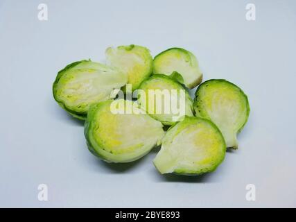 Cuts of brussels sprouts on a white isolated background Stock Photo