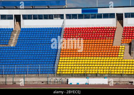 Empty rows of seats at football stadium Stock Photo