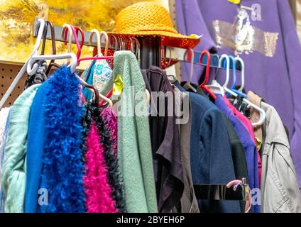 Rack of antique vintage clothing is on display and for sale at a antique shop Stock Photo