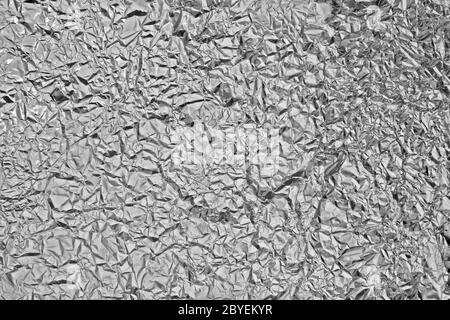 Pattern of Wrinkled Aluminium Foil Paper using as background Stock Photo