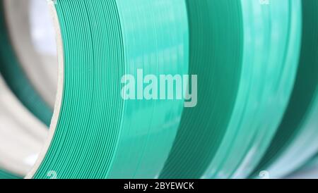 Green PP band for packaging and fastening of carton box ; Business industrial background Stock Photo