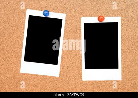 two blank instant photo frame on notice cork board Stock Photo