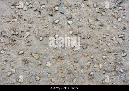 seamless flat concrete with rocks - grey texture and background Stock Photo