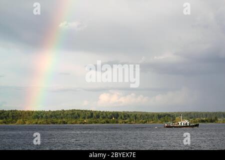 Multi-colored rainbow in the sky Stock Photo