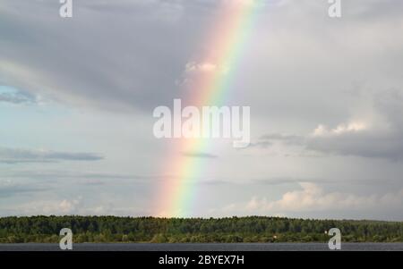 Multi-colored rainbow in the sky Stock Photo