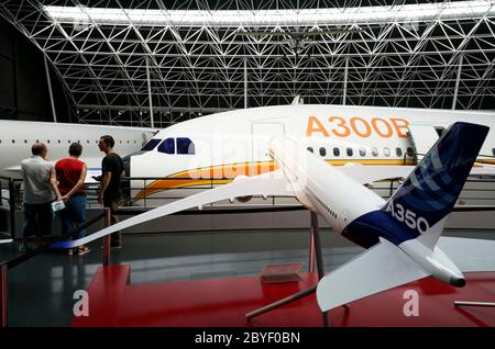 Airbus A300B wide body airliner with the model of Airbus A350 in foreground display in Musee Aeroscopia Museum. Blagnac.Toulouse.Haute-Garonne.Occitanie.France