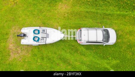 Aerial top view of a motor powerboat forming a circle of waves Stock ...