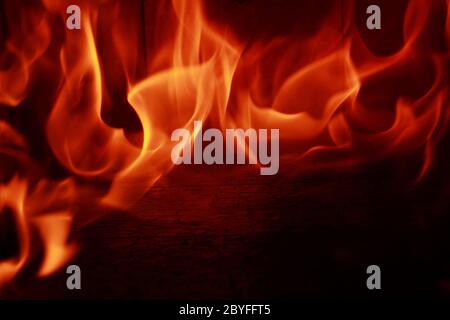Fire flames with reflection on black background Stock Photo