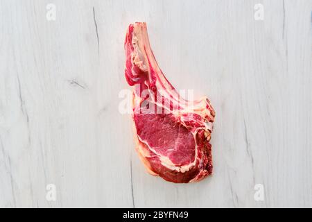 Overhead view of beef ribeye steak bone-in Stock Photo