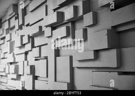 Black and white photo of geometric abstract background. Three-dimensional grunge backdrop with parallelogram and cube forms Stock Photo