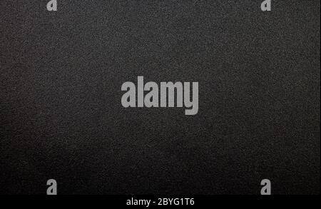 A metal plate texture in a black color. Stock Photo