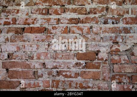 An old decayed brick wall as texture. Stock Photo