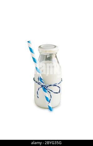 Milk bottle with striped straw. Cow's milk isolated on white. Stock Photo