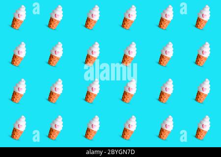 Bright and vivid seamless pattern made of a waffle cup ice cream on a light blue background. Trendy minimal summer concept. Stock Photo