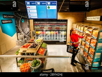 Duesseldorf, North Rhine-Westphalia, Germany - Supermarket of the future, smart and cashless shopping via access code authorisation with QR Code in th Stock Photo