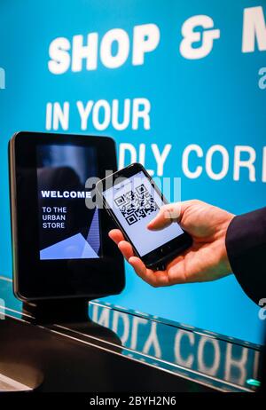 Duesseldorf, North Rhine-Westphalia, Germany - Access code authorization with QR Code in the 24/7 urban store of the future, mobile payment with mobil Stock Photo