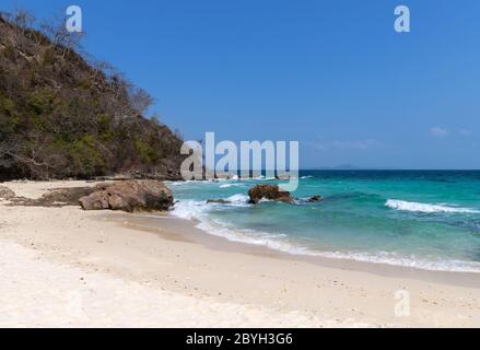 Soft wave of blue ocean sea on sandy beach Stock Photo